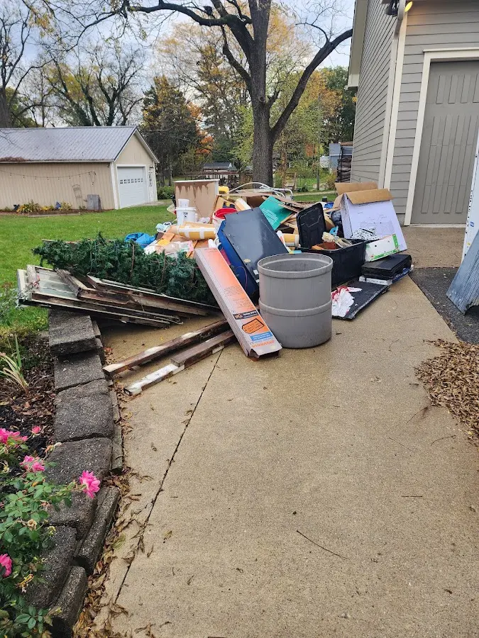 Dumpster being loaded with debris for Commercial Dumpster Rental in Belton